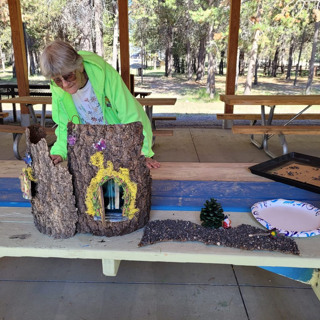 Darlene inspecting a lovely Fairy House.